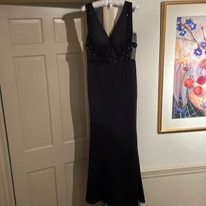 Long black form fitting gown with black beaded detail, brand new never worn